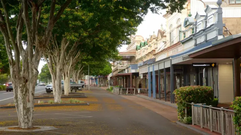 Heritage shopfronts and tree-lined main street in Childers