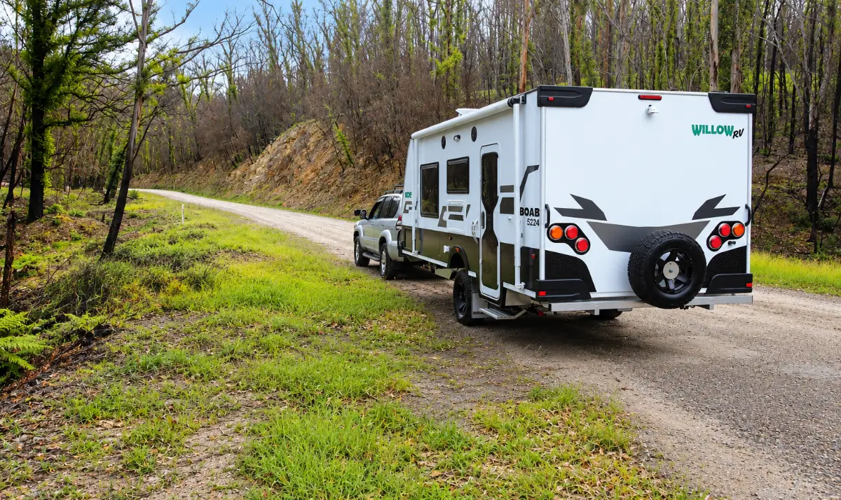 Willow RV Boab off-road caravan towed behind a 4WD along a country gravel road
